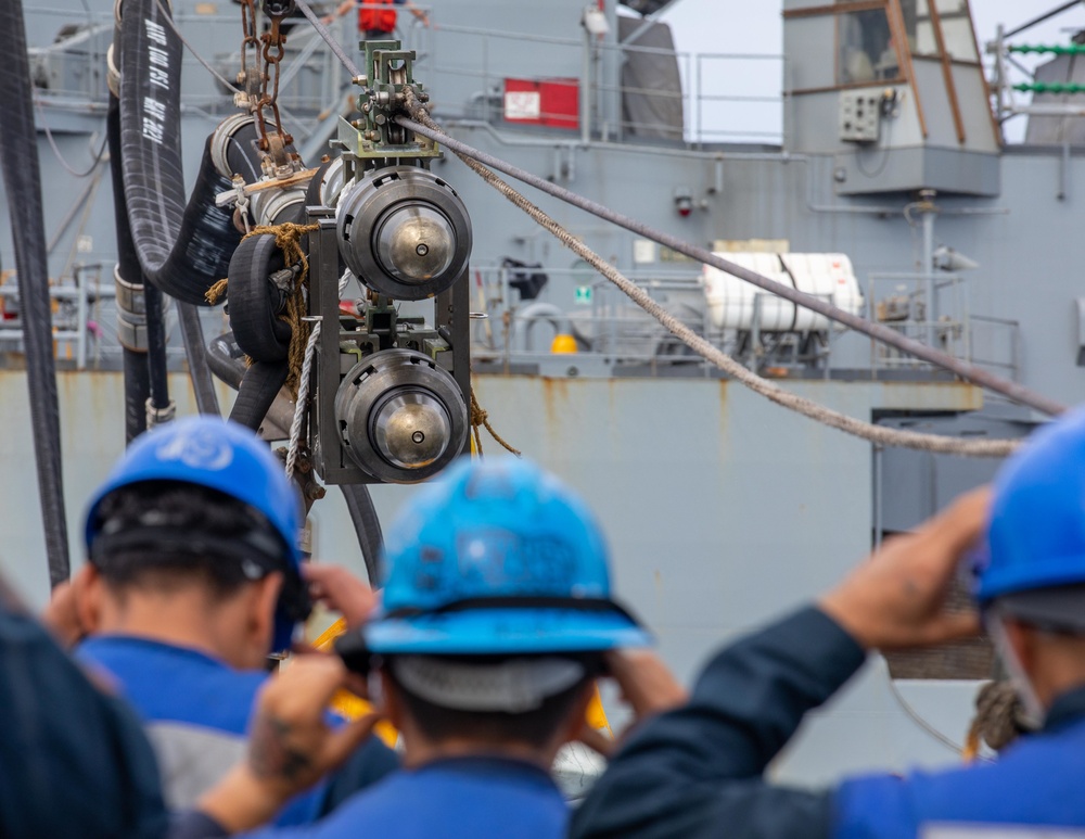 Sailors aboard the USS Dewey Standby to Receive a Fuel Probe from the USNS Matthew Perry