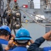 Sailors aboard the USS Dewey Standby to Receive a Fuel Probe from the USNS Matthew Perry