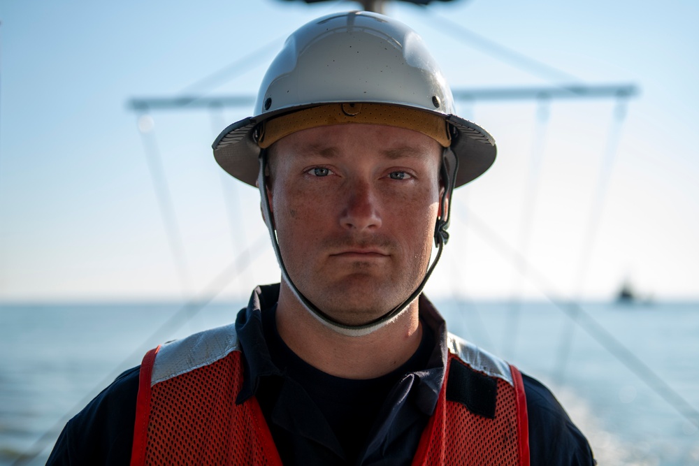 The crew aboard Coast Guard Cutter Axe