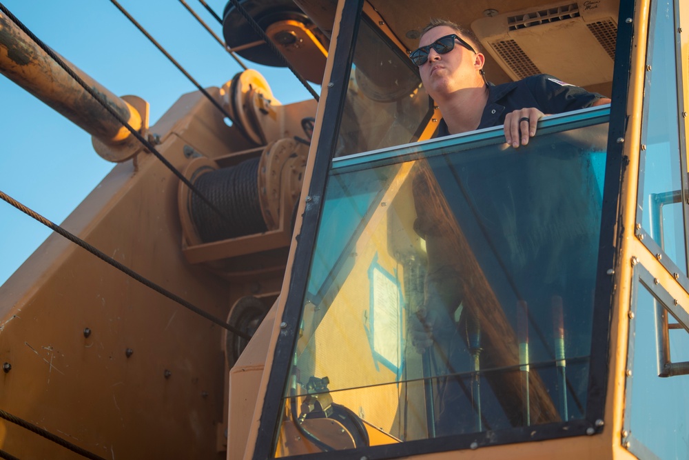 The crew aboard Coast Guard Cutter Axe