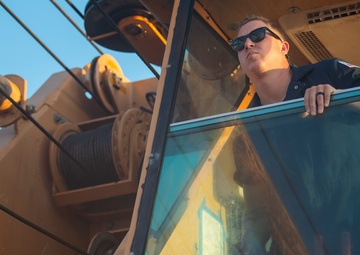 The crew aboard Coast Guard Cutter Axe