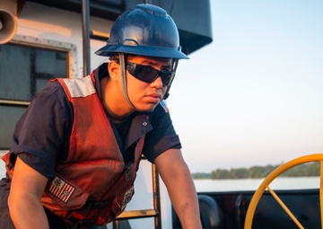 The crew aboard Coast Guard Cutter Axe