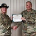 Staff Sgt. Michelle Ruland receives ARCOM