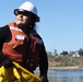 Contracted cleanup team removes containment booms near Carlsbad State Beach in San Diego County