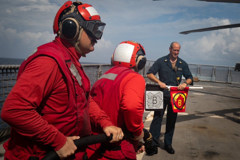 USS Sioux City Sailors Man the Hose During Flight Deck Fire Drill