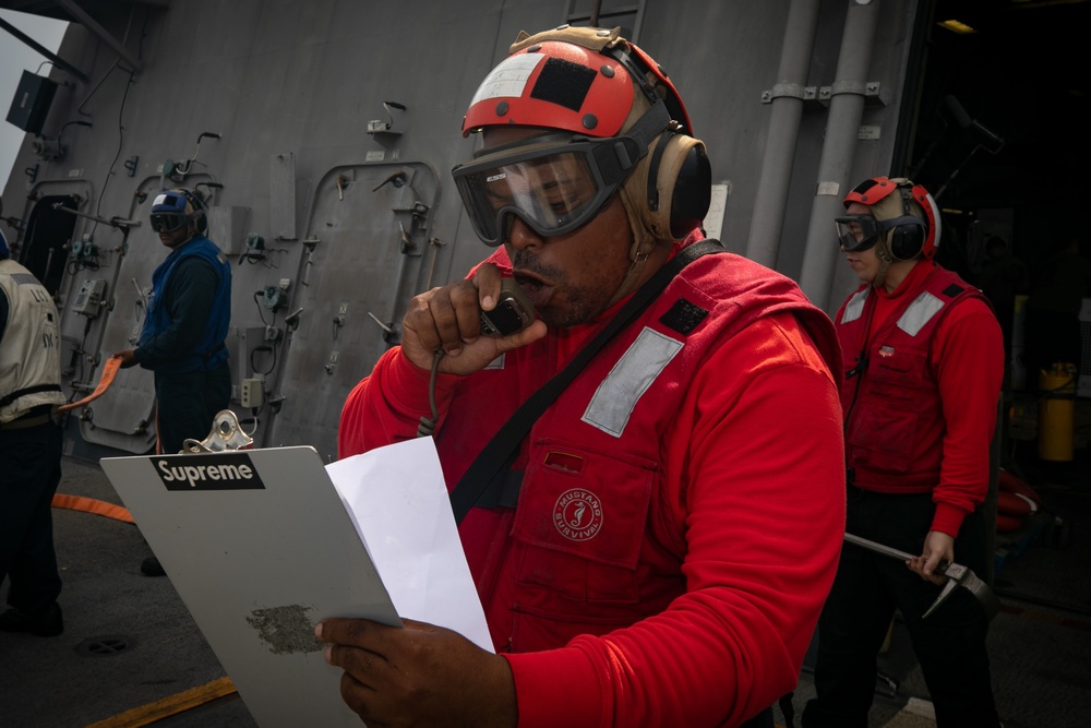 USS Sioux City Sailor Communicates with the Bridge During a Flight Deck Fire Drill