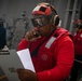 USS Sioux City Sailor Communicates with the Bridge During a Flight Deck Fire Drill