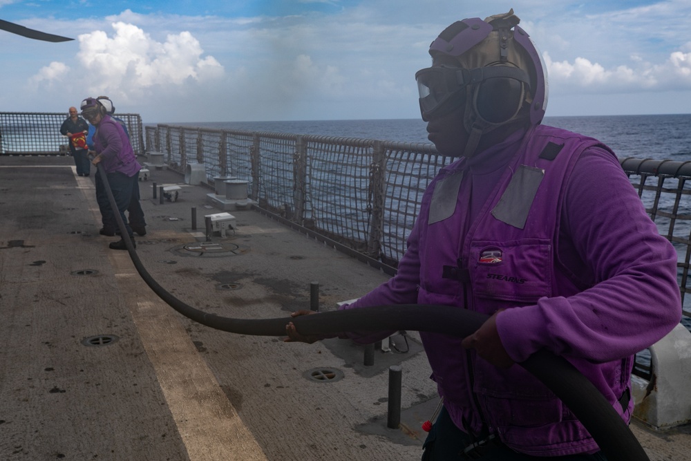 USS Sioux City Sailor Mans the Hose During a Flight Deck Fire Drill