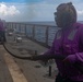 USS Sioux City Sailor Mans the Hose During a Flight Deck Fire Drill