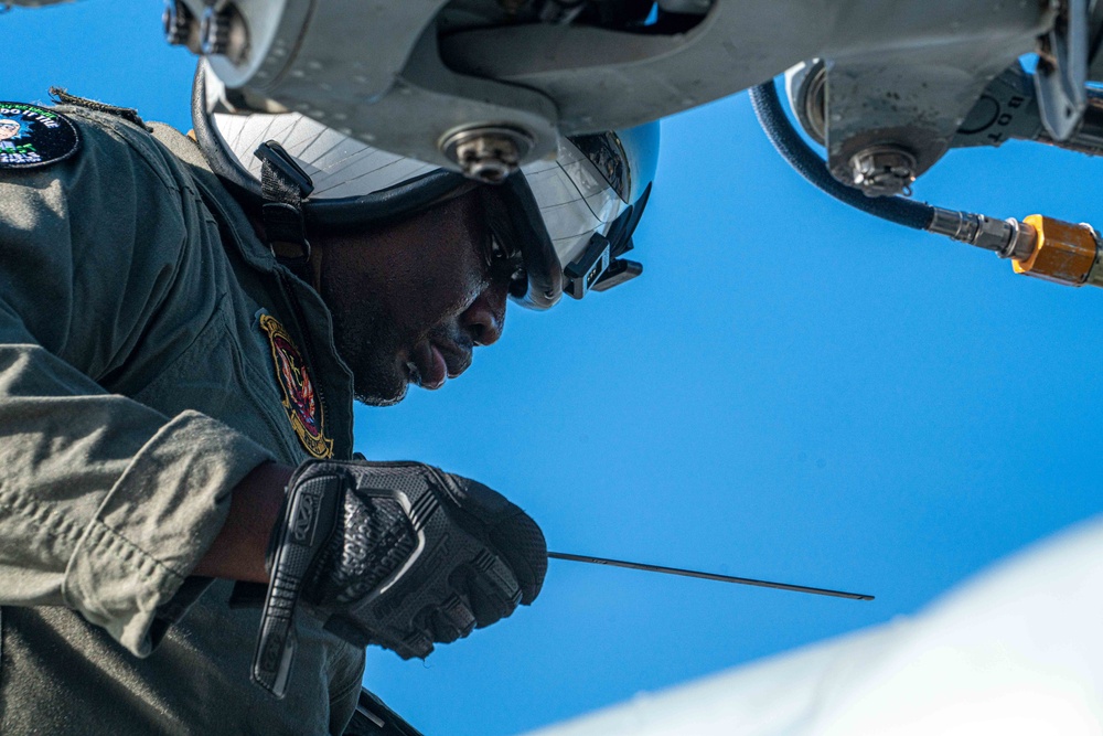 HSC-23 Sailor Conducts Pre-flight Check