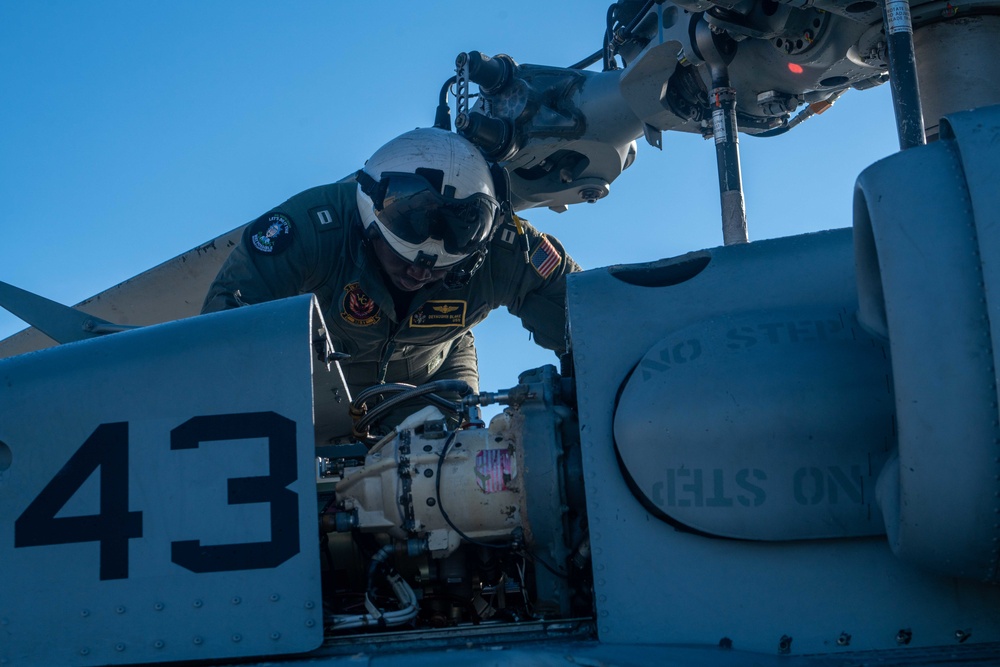 HSC 23 Sailor Conducts Pre-flight Check