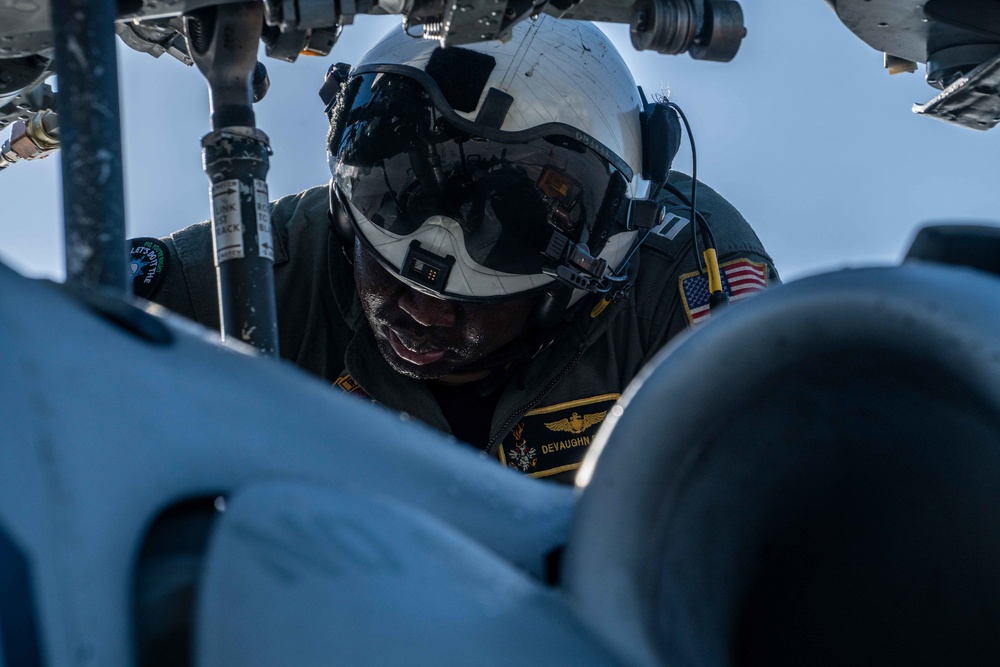 HSC 23 Sailor Conducts Pre-flight Check