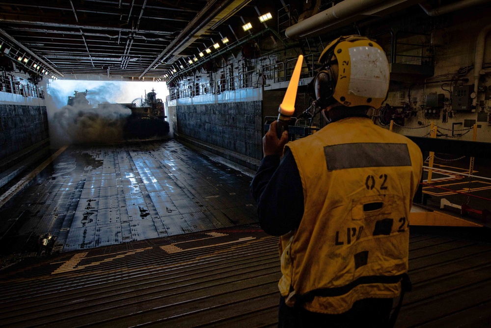USS Arlington Sailor Directs Landing Craft Air Cushion