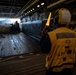 USS Arlington Sailor Directs Landing Craft Air Cushion
