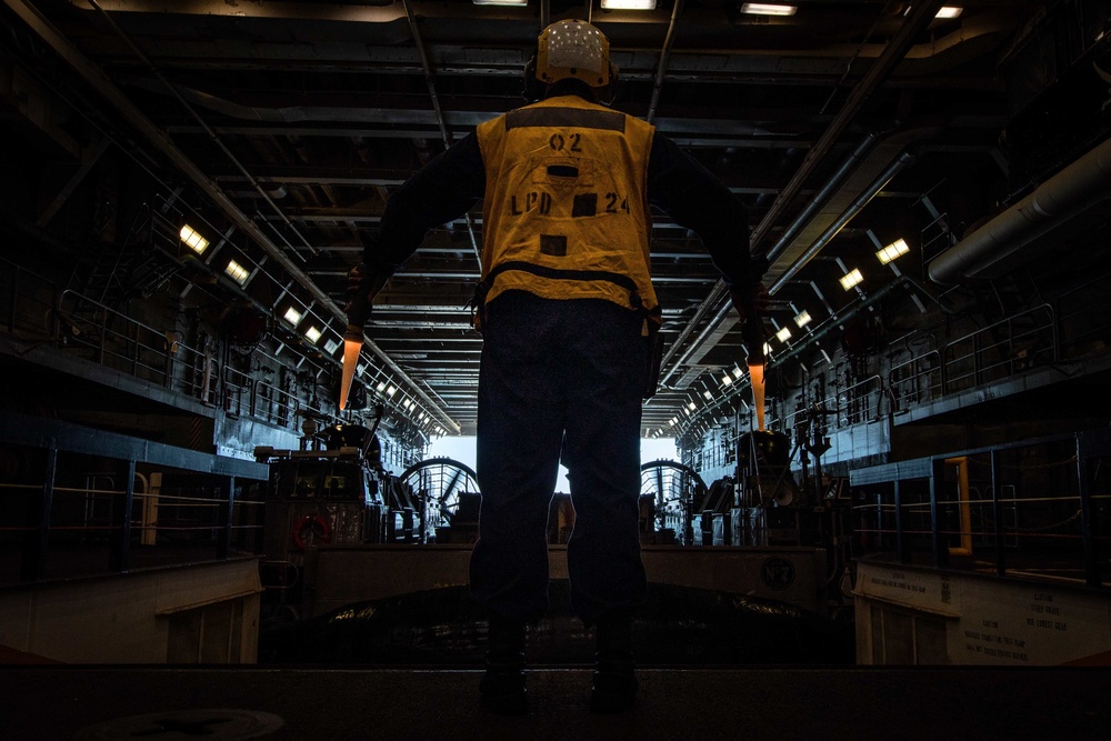 USS Arlington Sailor Directs Landing Craft Air Cushion