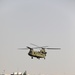 Chinook helicopters from C Co, 1-171 Aviation Regiment land at Camp Buehring