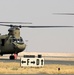 Chinook helicopters from C Co, 1-171 Aviation Regiment land at Camp Buehring