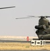 Chinook helicopters from C Co, 1-171 Aviation Regiment land at Camp Buehring