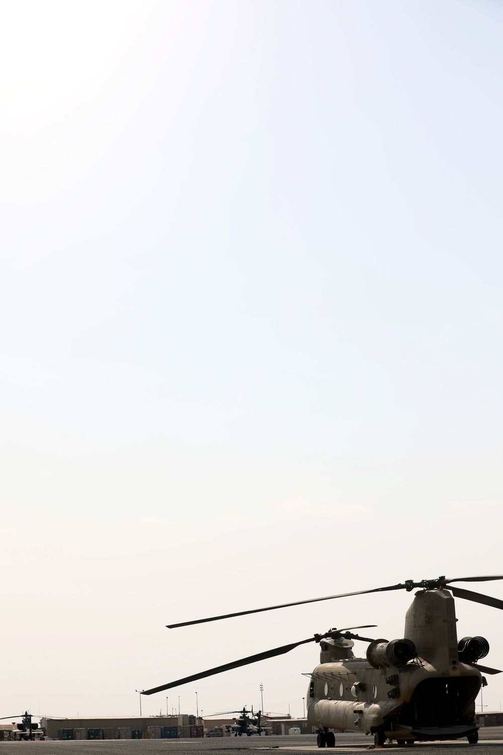 Chinook helicopters from C Co, 1-171 Aviation Regiment land at Camp Buehring