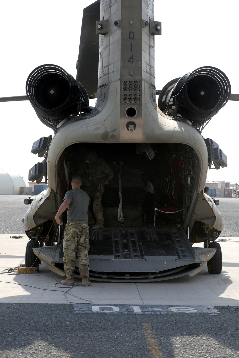 Chinook helicopters from C Co, 1-171 Aviation Regiment land at Camp Buehring