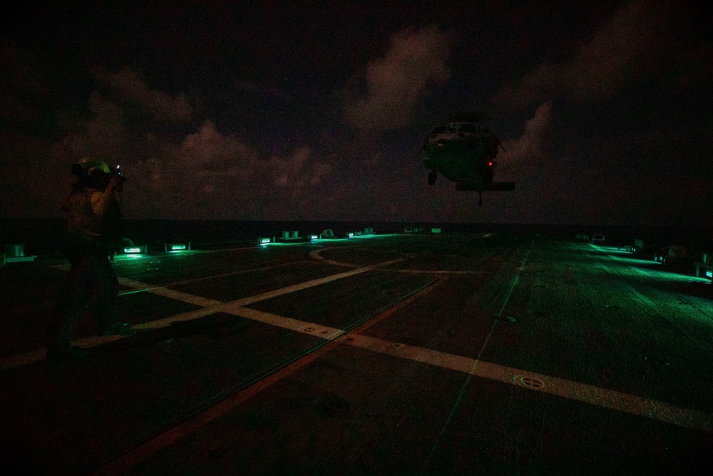 USS Sioux City Sailor Directs an MH-60S Sea Hawk Helicopter During Flight Ops
