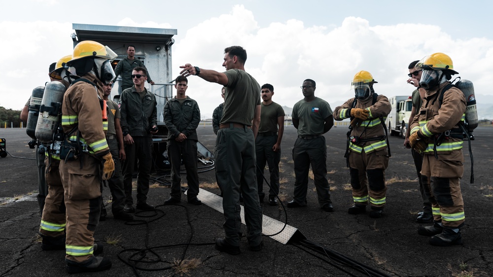 Distinguished Gentlemen Extinguish Small Fuel Fire Training