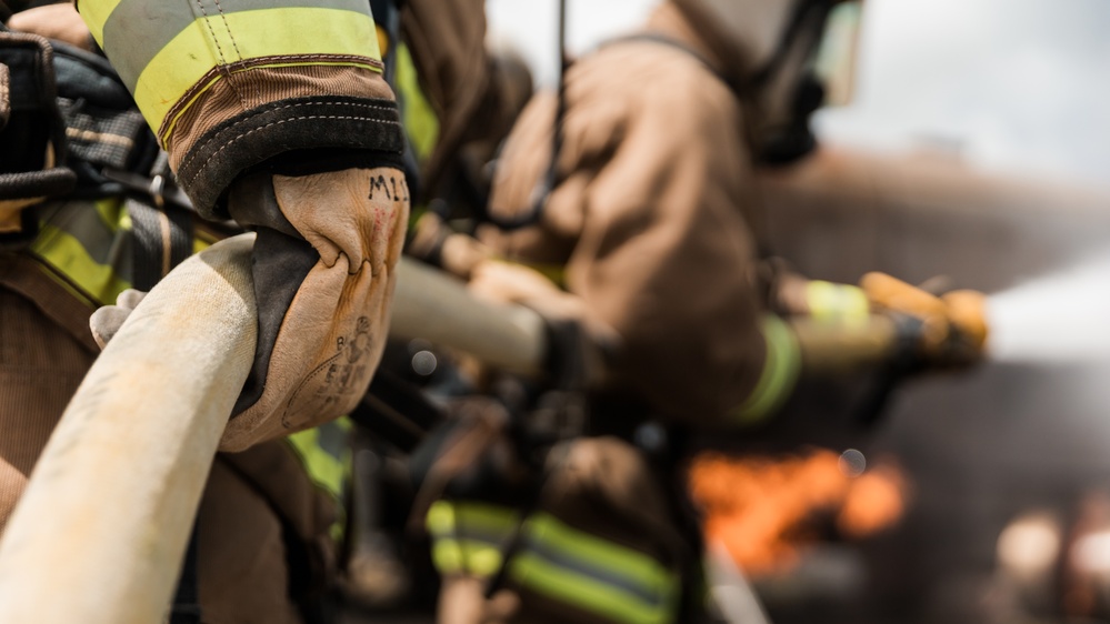 Distinguished Gentlemen Extinguish Small Fuel Fire Training