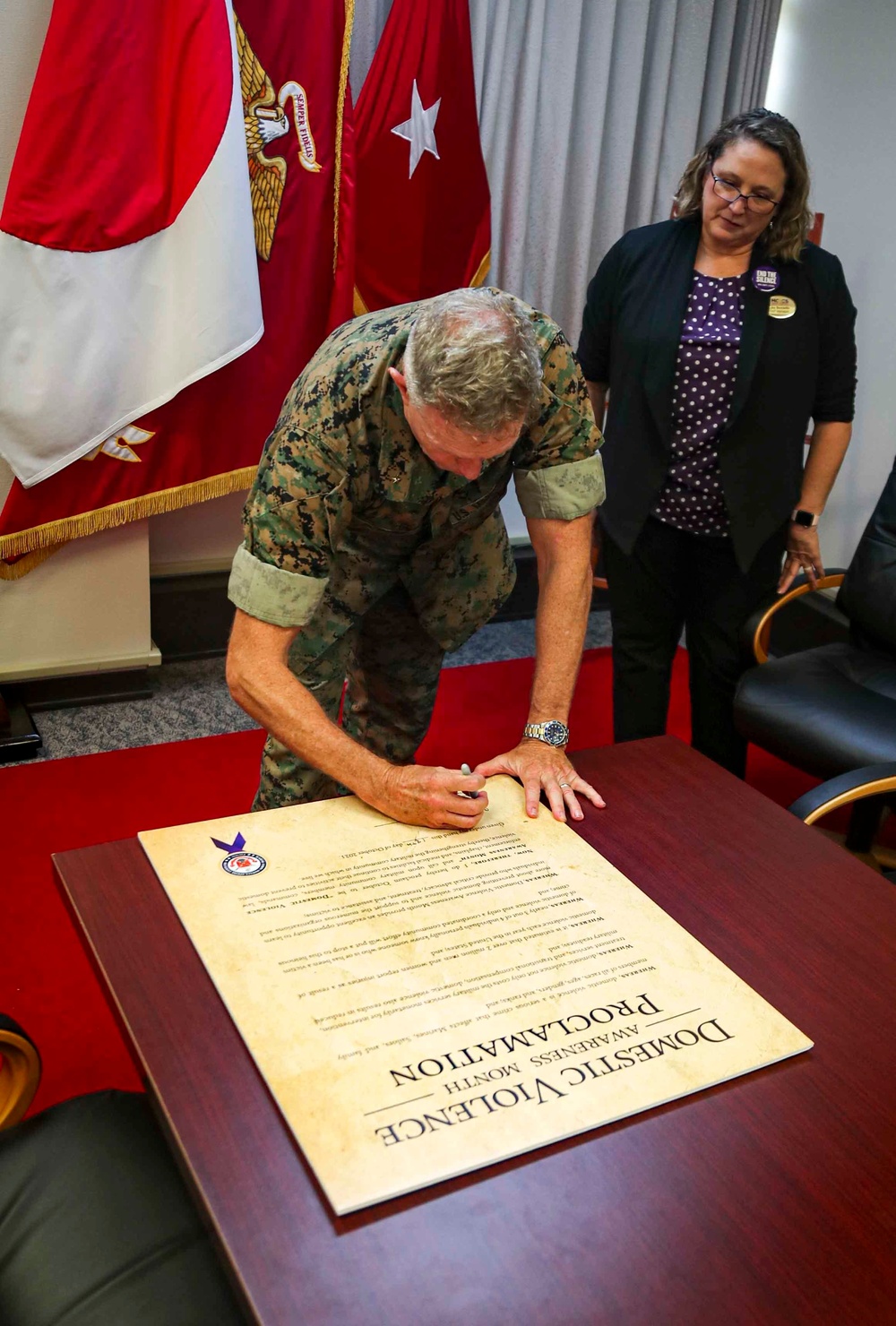 The Commanding General of MCIPAC signs Domestic Violence Awareness Month Proclamation