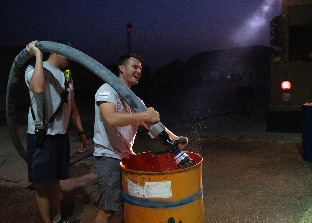 Airmen celebrate Fire Prevention Week with 'Bucket Brigade Challenge'