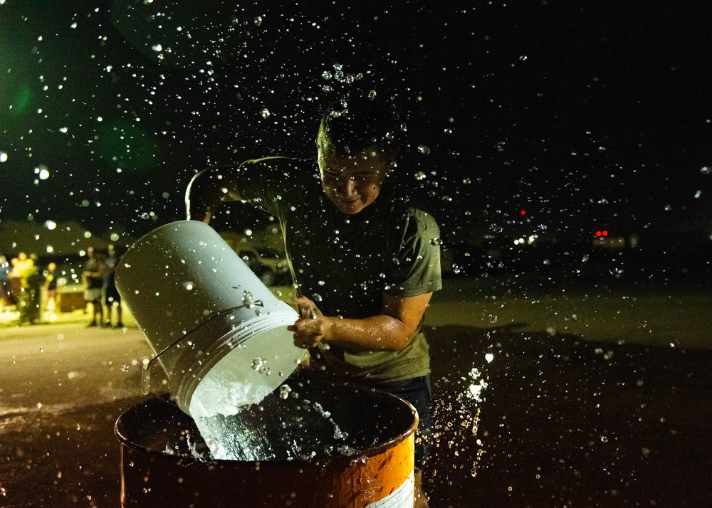 Airmen celebrate Fire Prevention Week with 'Bucket Brigade Challenge'