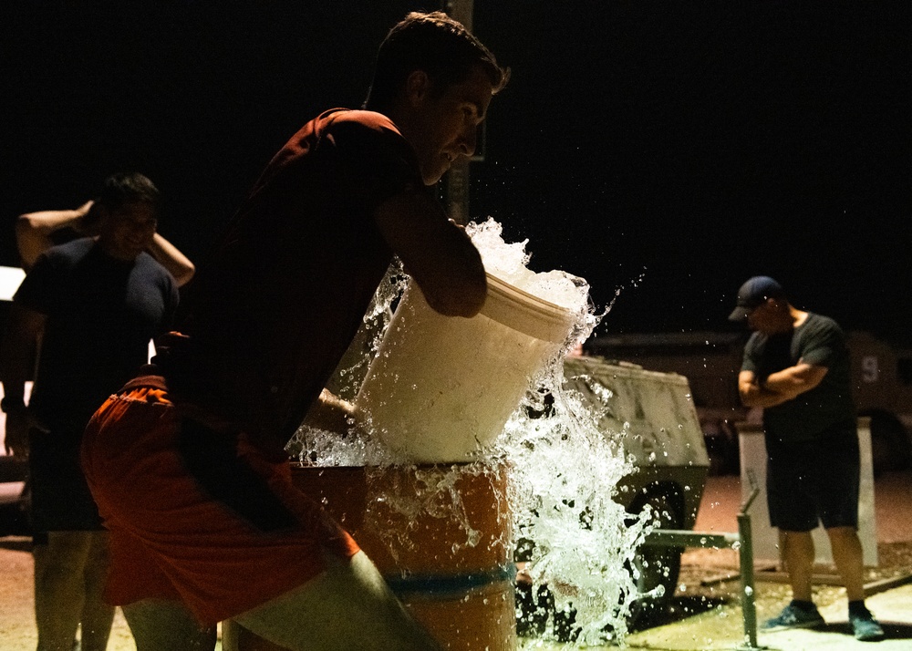 Airmen celebrate Fire Prevention Week with 'Bucket Brigade Challenge'