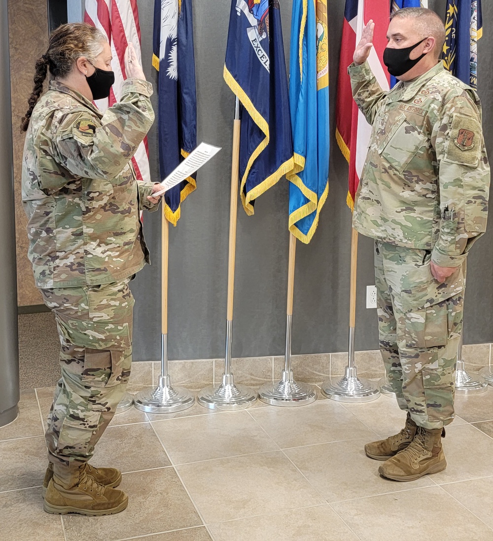 Roberts reenlists in the Air National Guard