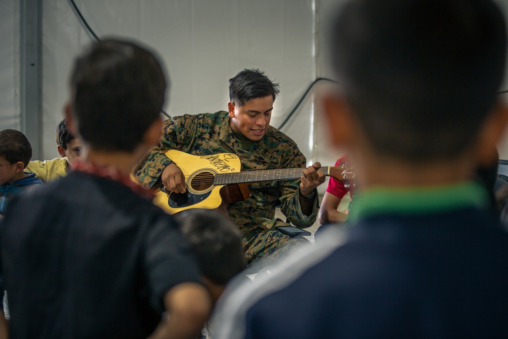 Marine Shares Passion for Music with Afghan Guests
