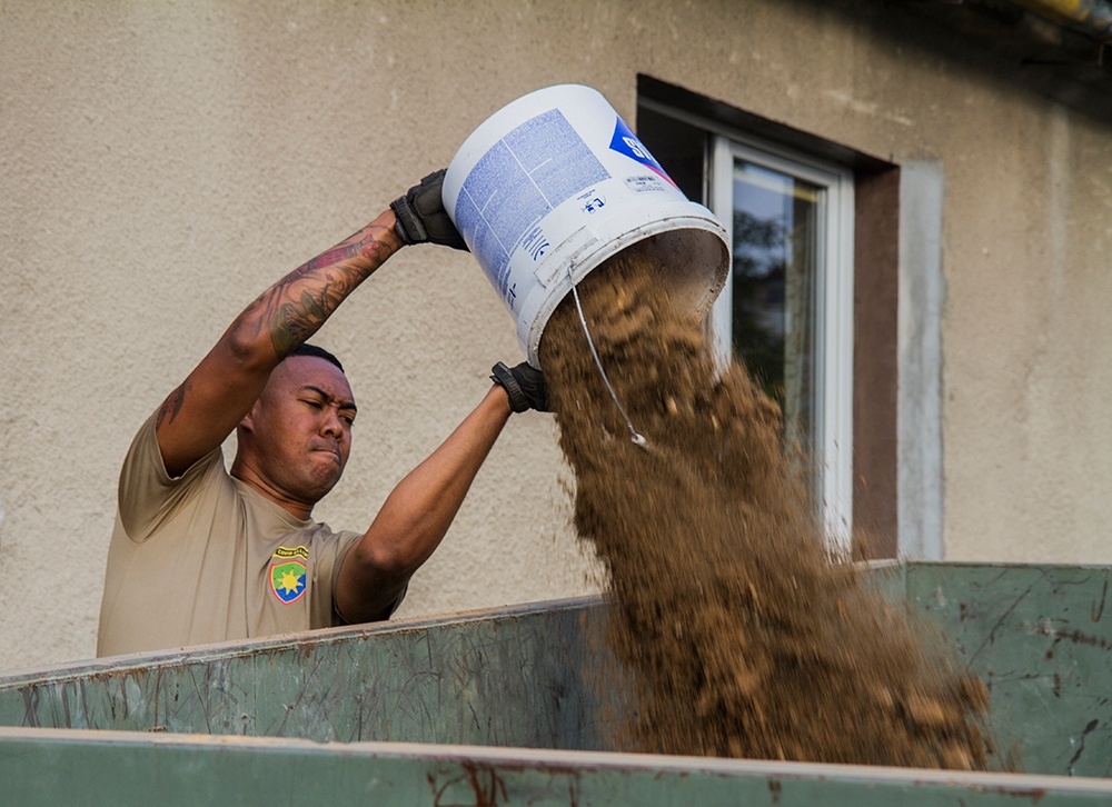 50th Regional Support Group Soldiers join community efforts to help renovate house in Poland