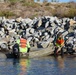 Scientists and researchers from the Nature Collective survey the oil spill impact in San Elijo Lagoon
