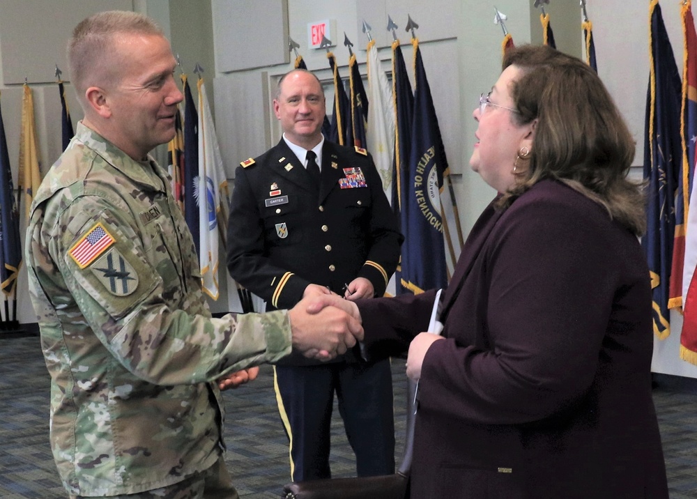 Maj. Gen. Tom Carden congratulates Dania Aponte