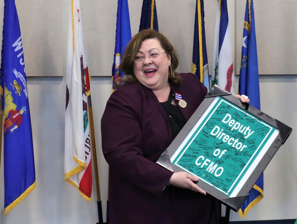 maintenance staff presents a farewell gift to Dania Aponte