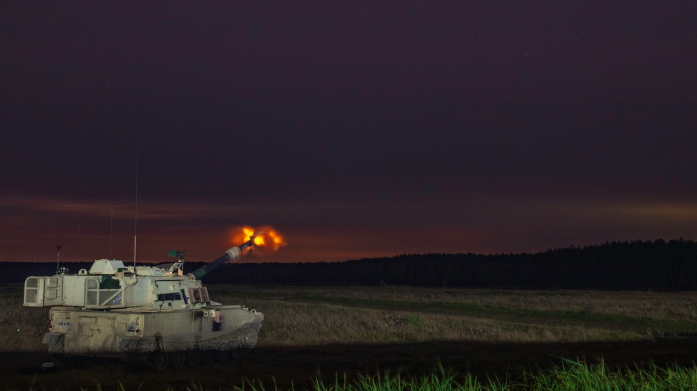 Victory Eagle conducts a combined arms artillery night live-fire at DPTA