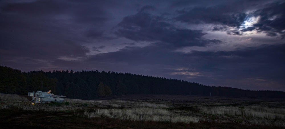 Victory Eagle conducts a combined arms artillery night live-fire at DPTA