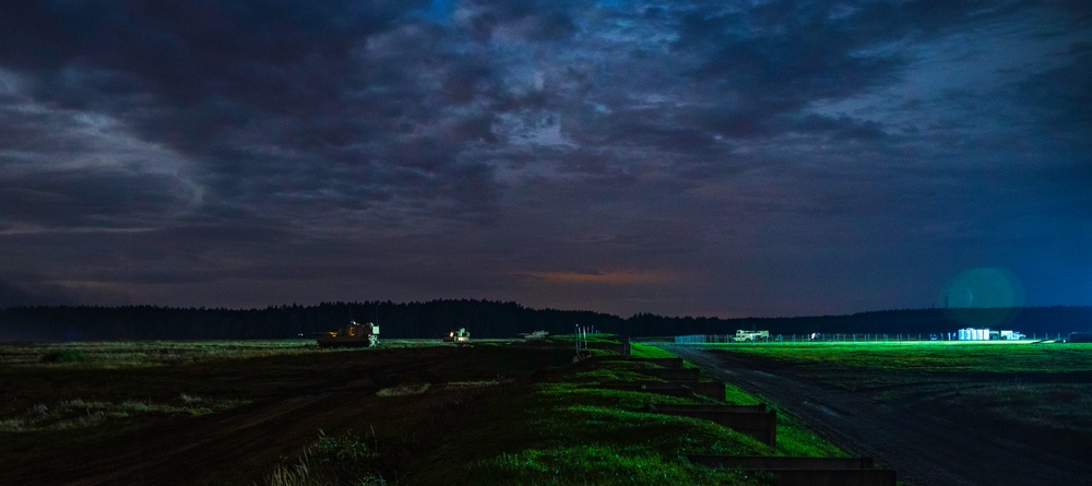 Victory Eagle conducts a combined arms artillery night live-fire at DPTA