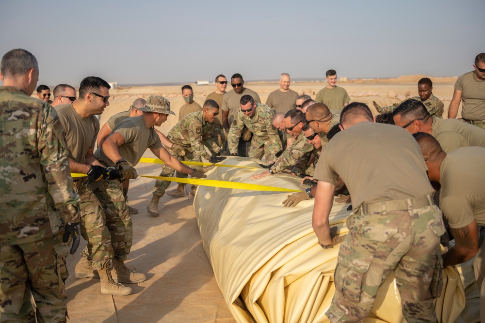 332nd AEW Airmen layout collapsible fabric tank