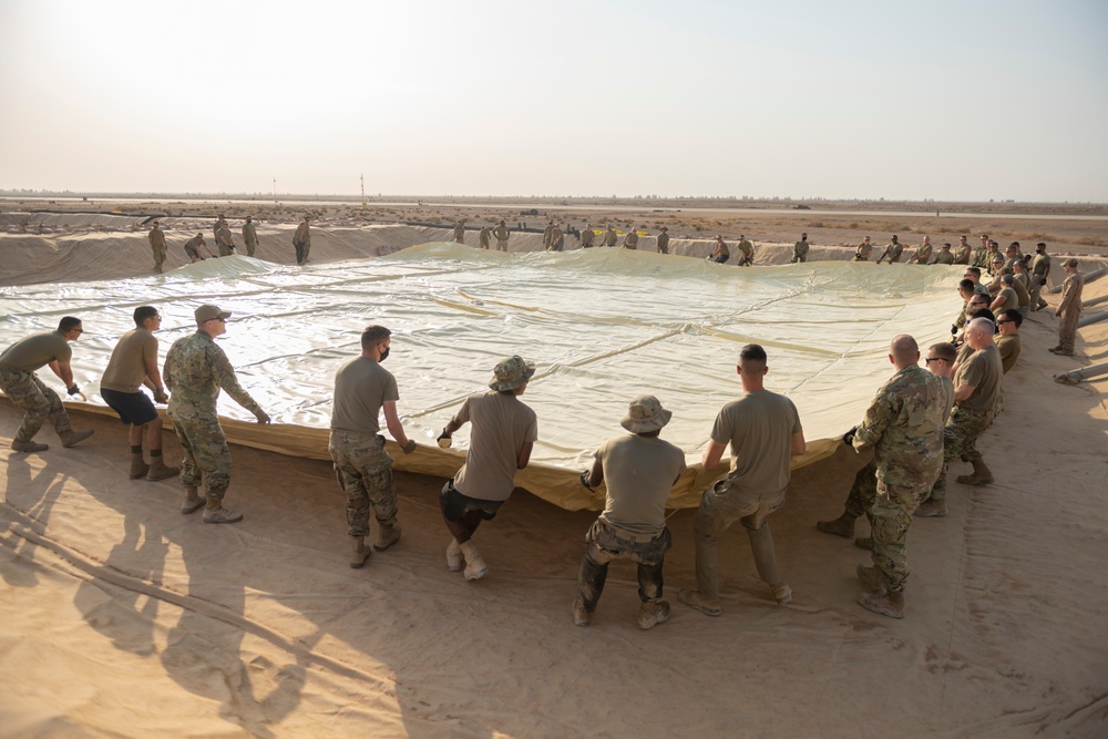 332nd AEW Airmen layout collapsible fabric tank