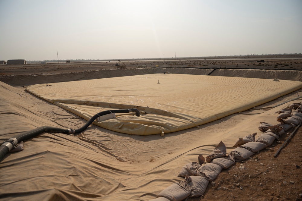 332nd AEW Airmen layout collapsible fabric tank