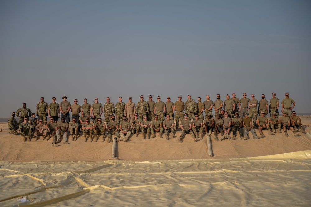 332nd AEW Airmen layout collapsible fabric tank