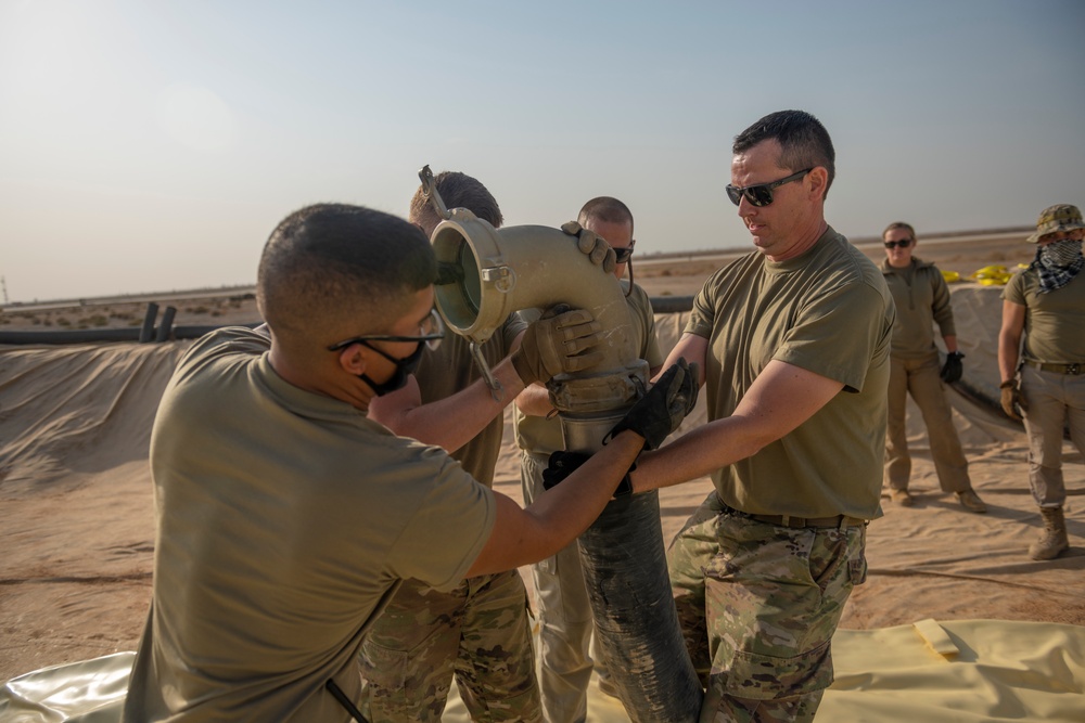 332nd AEW Airmen layout collapsible fabric tank