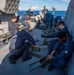 USS Billings Sailors Break Down .50-Caliber Rounds in Preparation for a Live-Fire Exercise