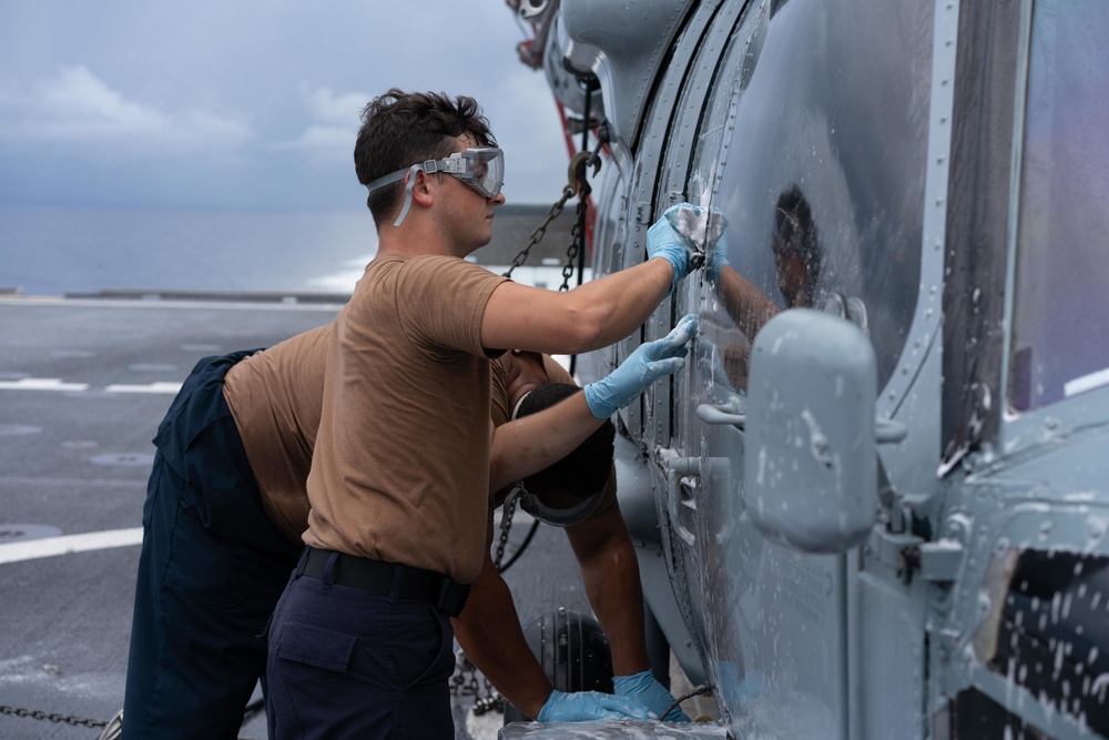 HSC 23 Sailor Washes Helicopter