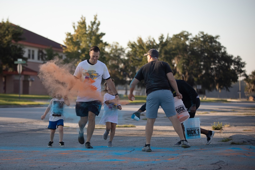 3rd Combat Aviation Brigade Soldiers and Families run in the Brawler 5k Color Run.