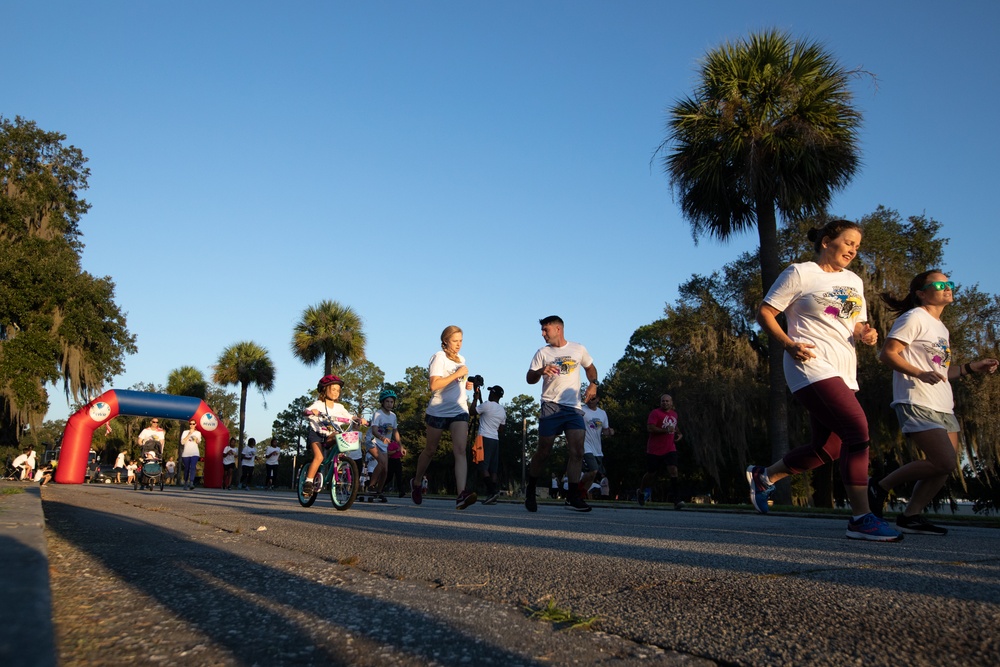 3rd Combat Aviation Brigade Soldiers and Families run in the Brawler 5k Color Run.