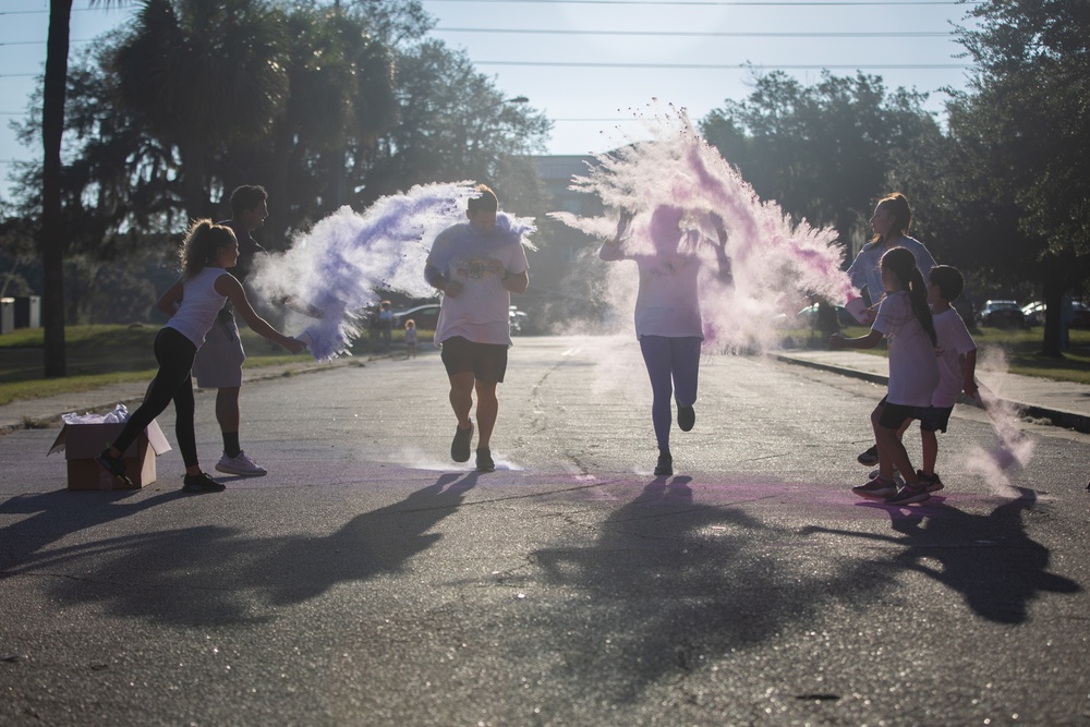 3rd Combat Aviation Brigade Soldiers and Families run in the Brawler 5k Color Run.